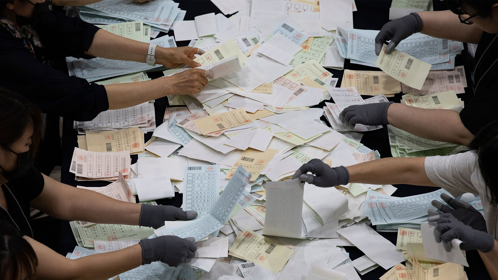 Election officials count ballots after voting in the national local elections was closed, in Seoul, South Korea