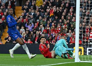 Curtis Jones of Liverpool scoring the second Liverpool goal making the score 2-1 during the Premier League match between Liverpool FC and Chelsea FC at Anfield on October 20, 2024 in Liverpool, England.