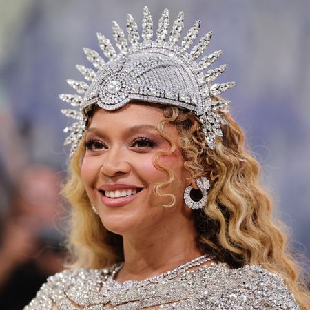 beyonce attends the 2026 met gala wearing a silver headpiece and mermaid curls