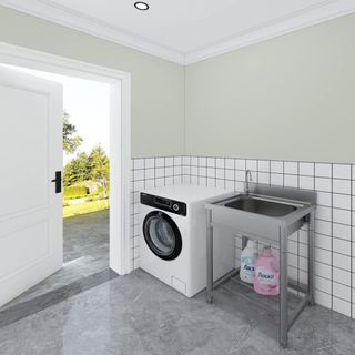 A utilitarian laundry room sink in a laundry room
