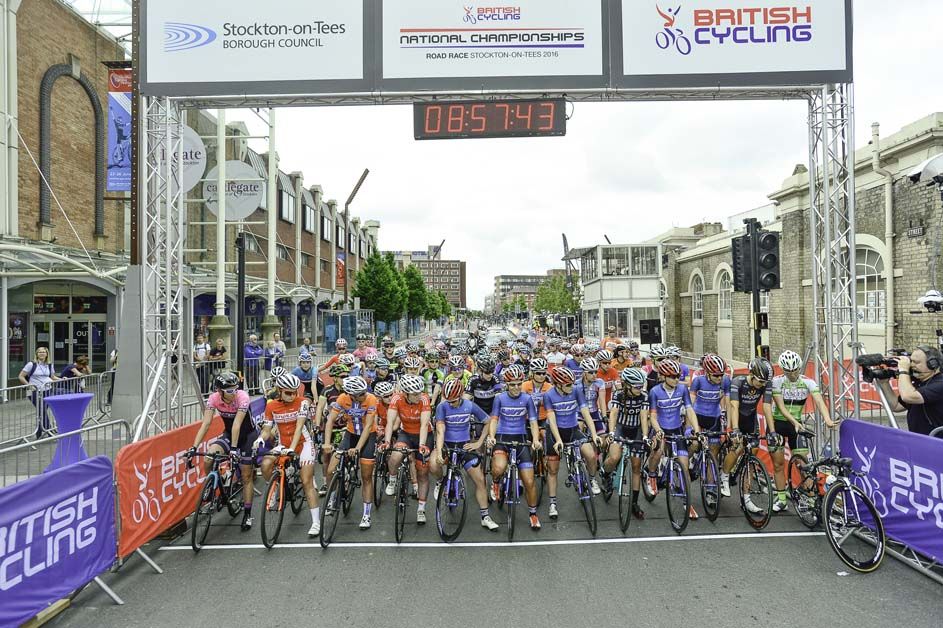 The peloton waits on the start line