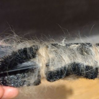 Image of tangled hair in robot vacuum cleaner brush