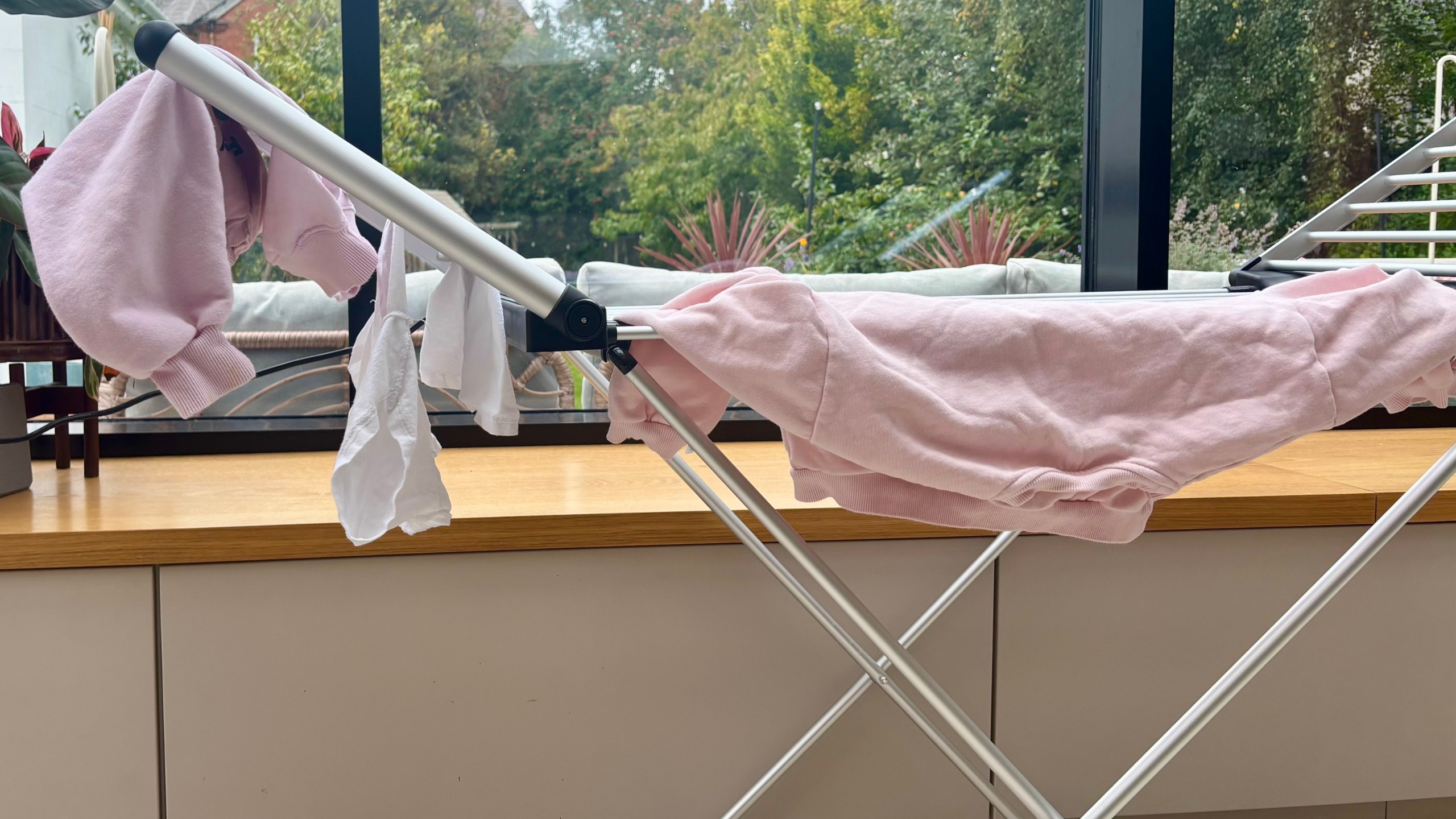 beldray winged heated clothes airer with hanging clothes close up
