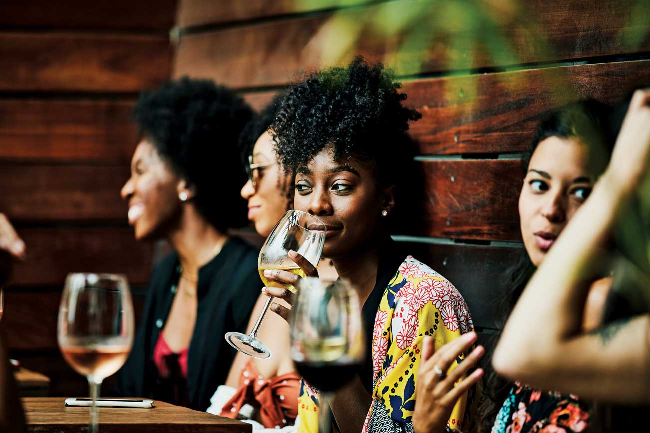 Young people drinking wine