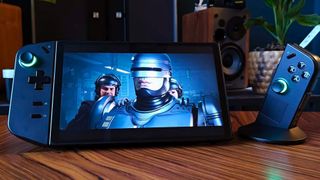 Lenovo Legion Go with right hand controller detached and Robocop: Rogue City gameplay on screen.