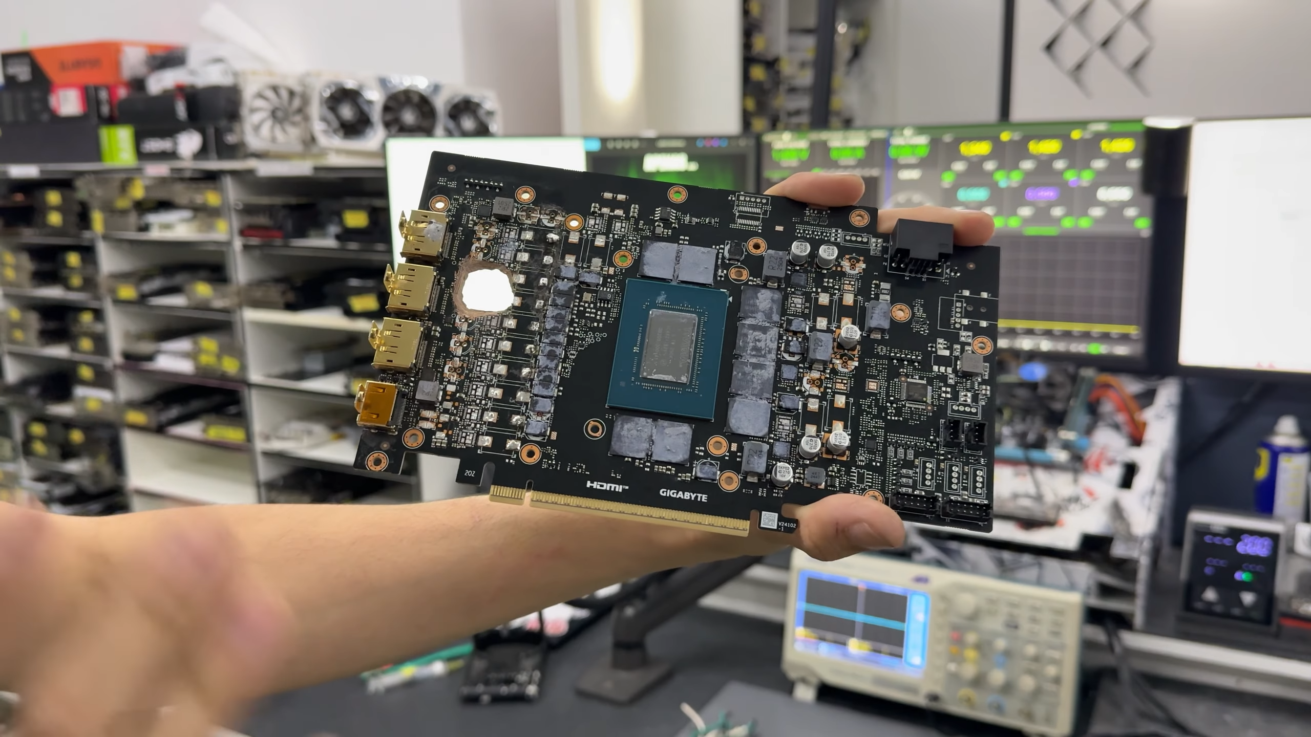 Dead RTX 5070 Ti with a hole burnt through its PCB