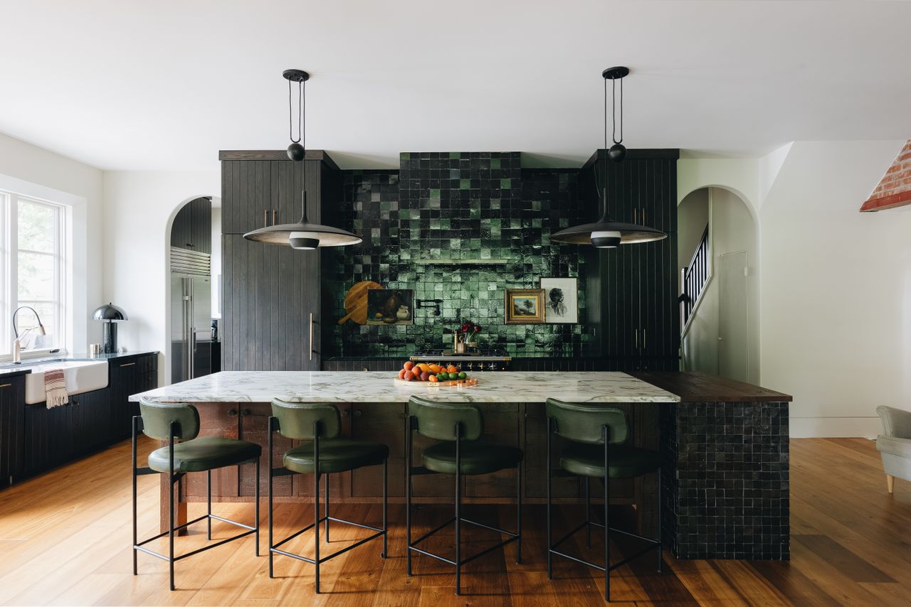 a kitchen with dark tiles