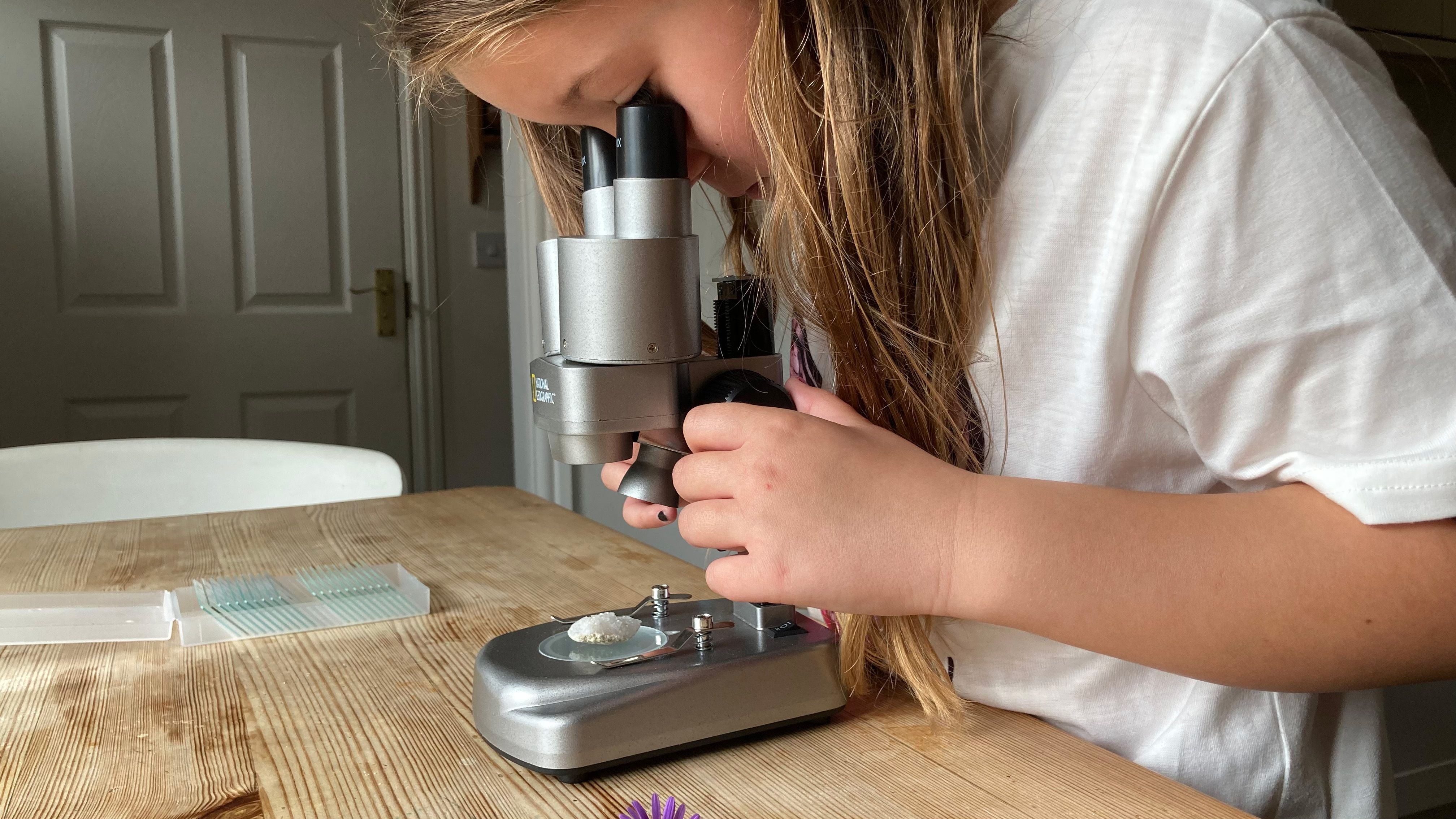 National Geographic Ultimate Dual Stereo Microscope being used by a child