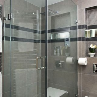 bathroom with shower and glass