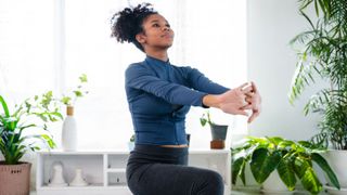 Woman stretching back with arms out