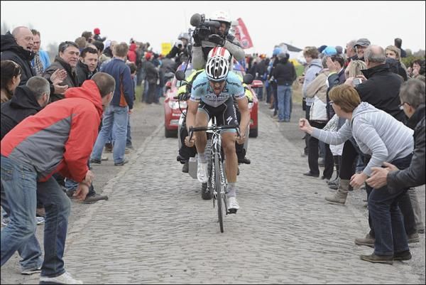 Tom Boonen is urged on by spectators during his winning attack at Paris-Roubaix.