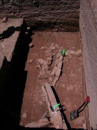 This excavation reveals two building periods in Peru, with evidence of burning found at the higher level, at a site called Taraco.
