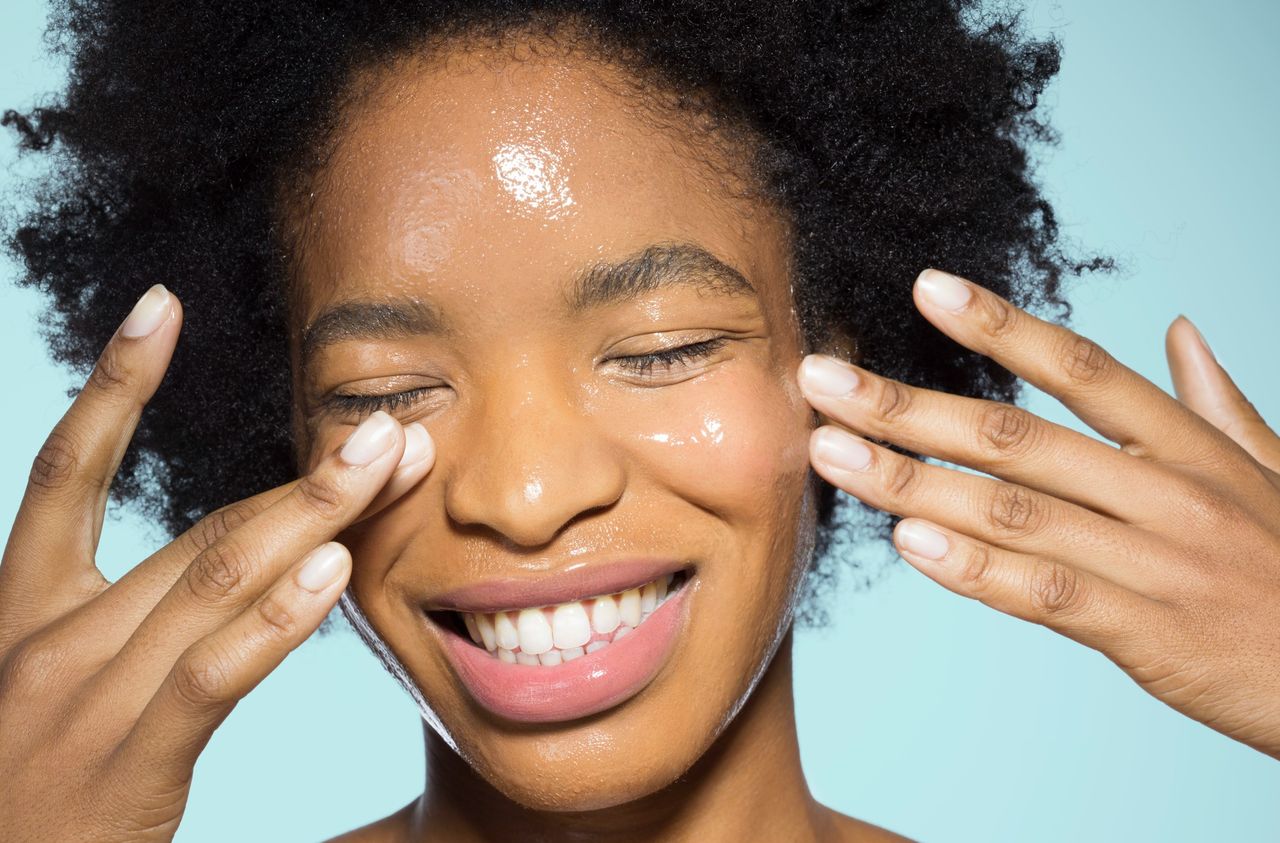 Woman applying skincare