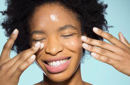 Woman applying skincare