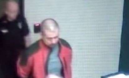 In a screen shot of police surveillance footage, George Zimmerman appears largely blood and scratch free, despite his claim of a violent tussle.