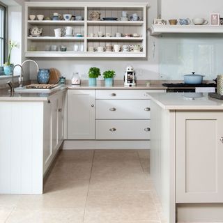 kitchen with white cabinet and crockery shelf