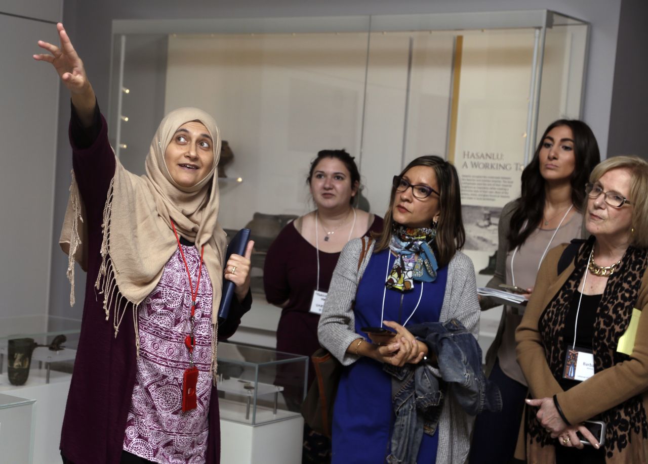 Moumena Saradar, originally from Syria, guides visitors through the Middle East gallery at Penn Museum in Philadelphia.