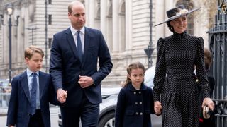 Prince William, Duke of Cambridge and Prince George of Cambridge with Catherine, Duchess of Cambridge and Princess Charlotte of Cambridge attend a memorial service for the Duke of Edinburgh at Westminster Abbey on March 29, 2022 in London, England.