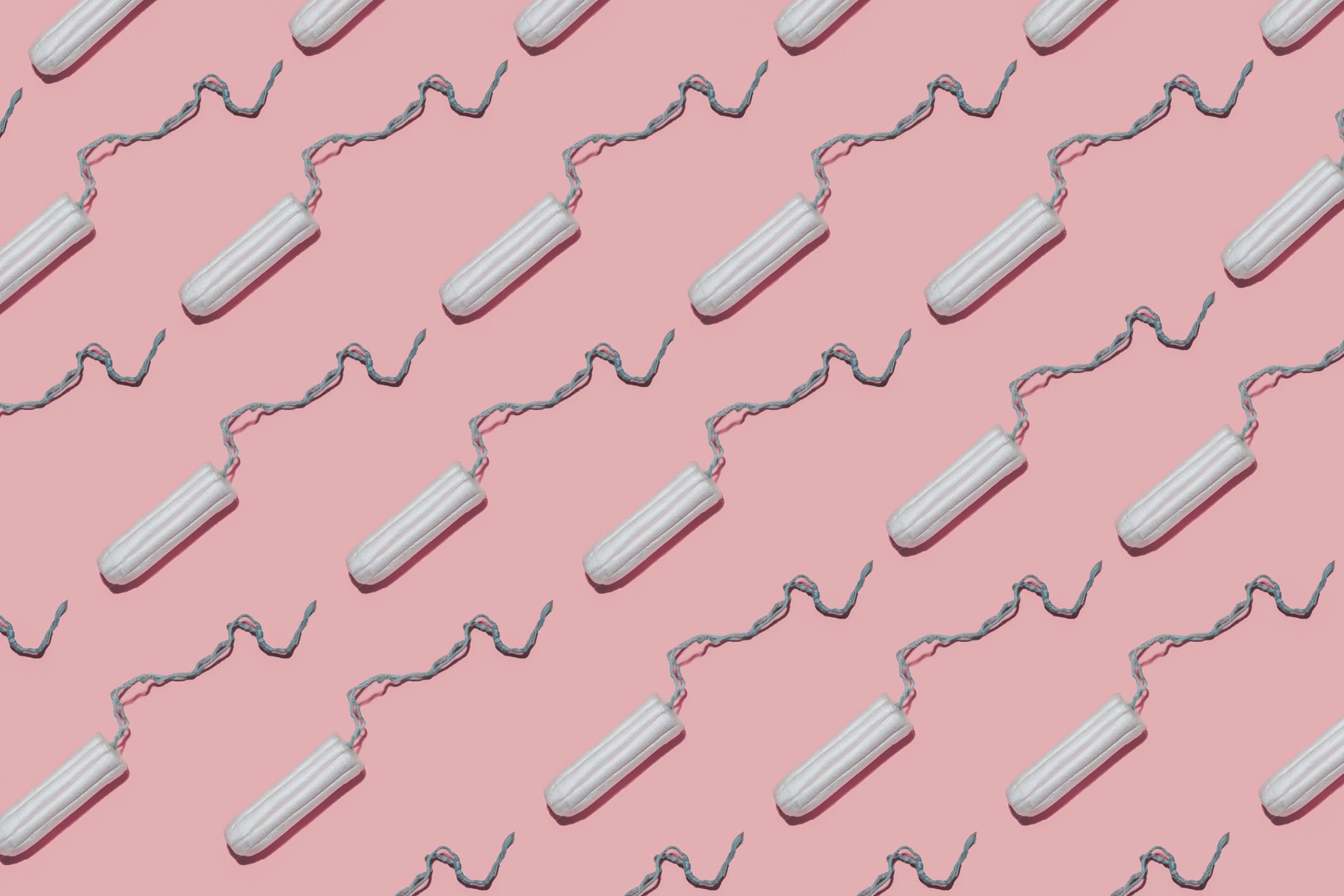 Tampons on pink background