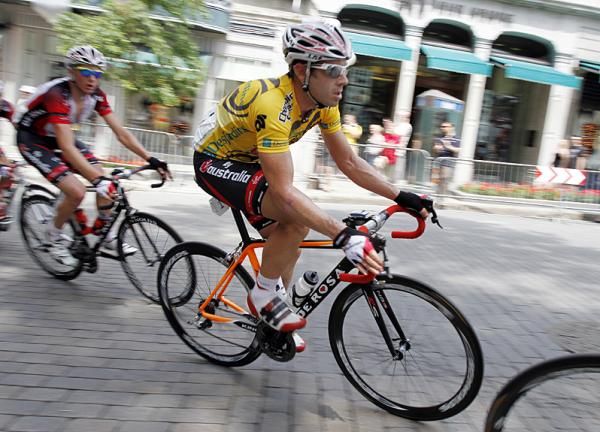 Overall leader 2010 Ben Day (Fly V Australia) rides in the peloton, well surrounded by his teammates.