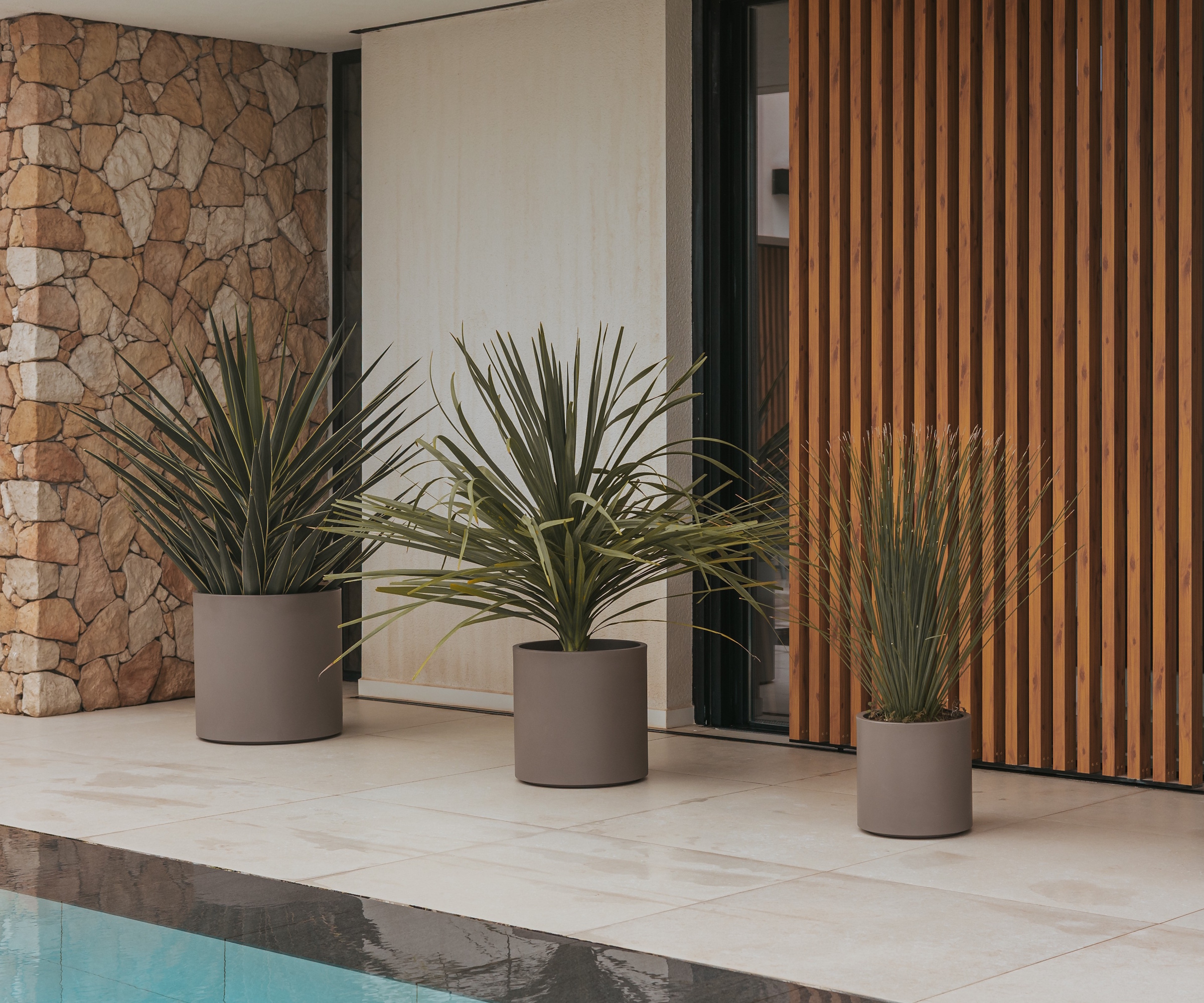 Newgarden HORTENSIA pots surrounding a pool area