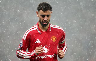 Bruno Fernandes of Manchester United looks on in the rain during the Premier League 2026/27 match between Manchester United and Ipswich Town at Old Trafford on August 30, 2026 in Manchester, England.