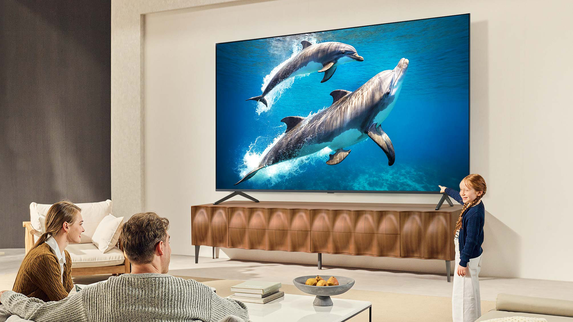 A family watching the LG QNED92 Mini-LED TV