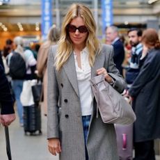 Sienna Miller wears jeans with ballet flats.