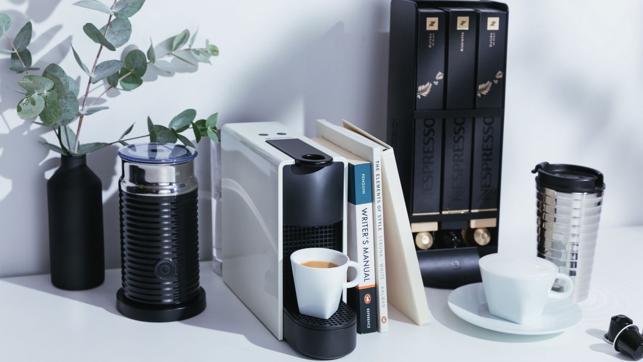 Nespresso Essenza Mini in white with Nespresso Aeroccinno milk frother and coffee capsules