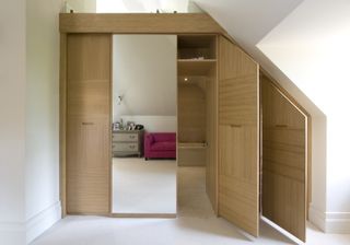 a concealed door ensuite idea within fitted wardrobes