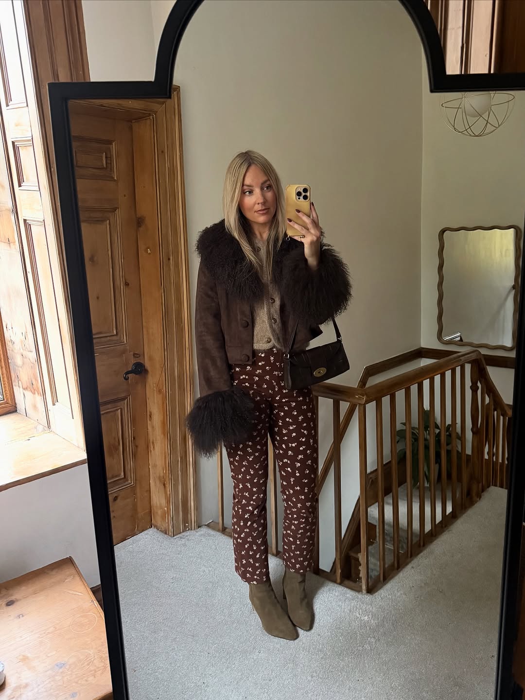 woman wearing suede pointed toe ankle boots trend 2025