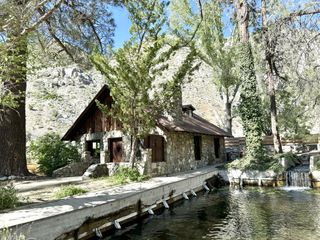 The stone Chaplin Cabin at Huttopia Paradise Springs in Southern California