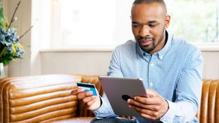 Man buying something on his iPad