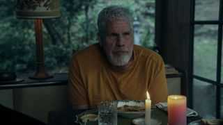 Toby Hellinger (Ron Perlman) at the dinner table in Mr. & Mrs. Smith episode 5.