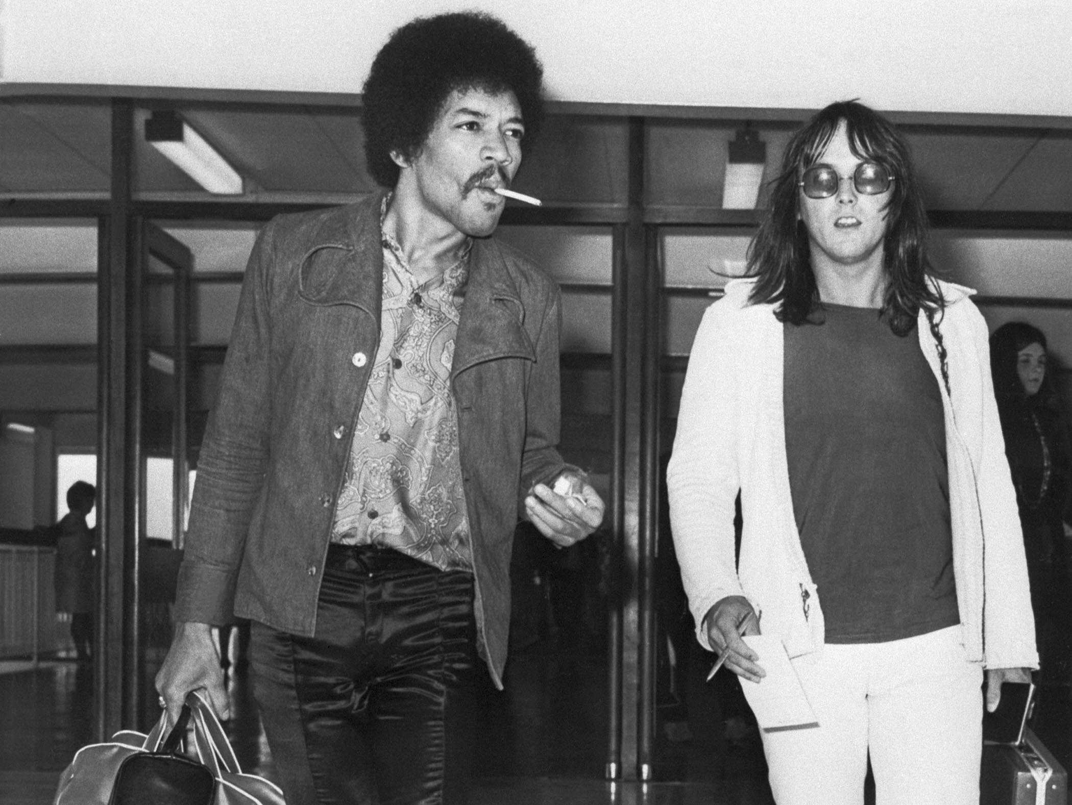 Jimi Hendrix and Eric Barrett arrive at Heathrow airport in 1970