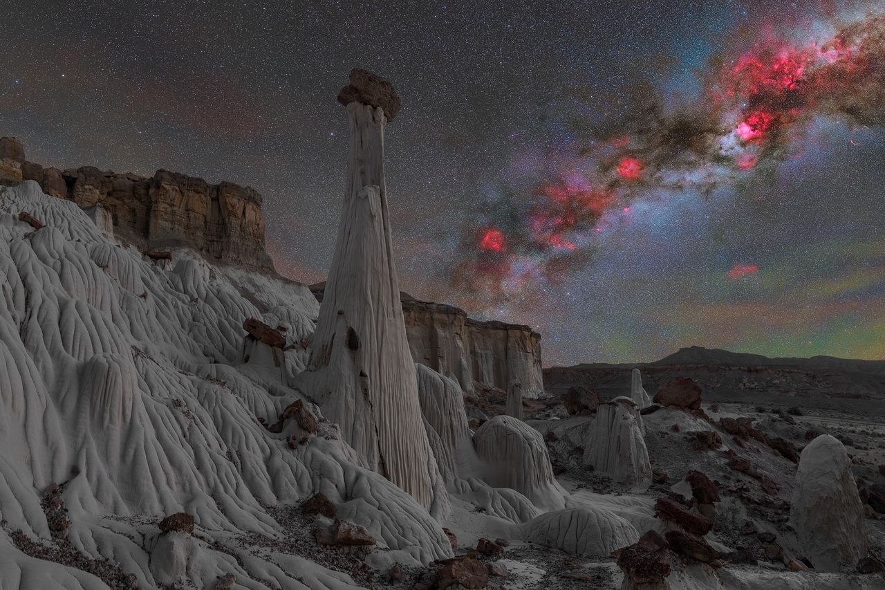A photograph taken by pilot Ralf Rohner of rock formations with the Milky Way