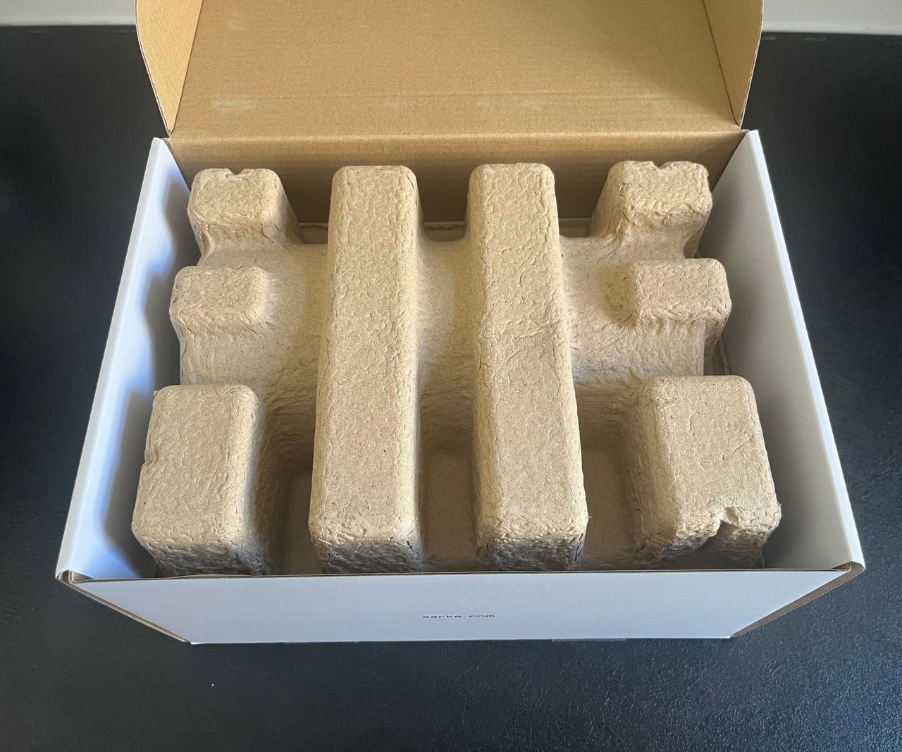 The inside of a cardboard box with cardboard packaging