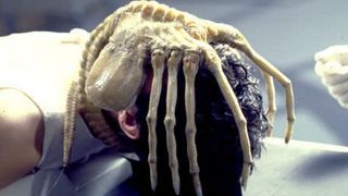 A facehugger latched onto a man's face during one of the best alien movies of all time, Alien.