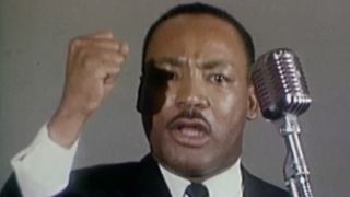 Martin Luther King Jr. giving a speech in King in the Wilderness.