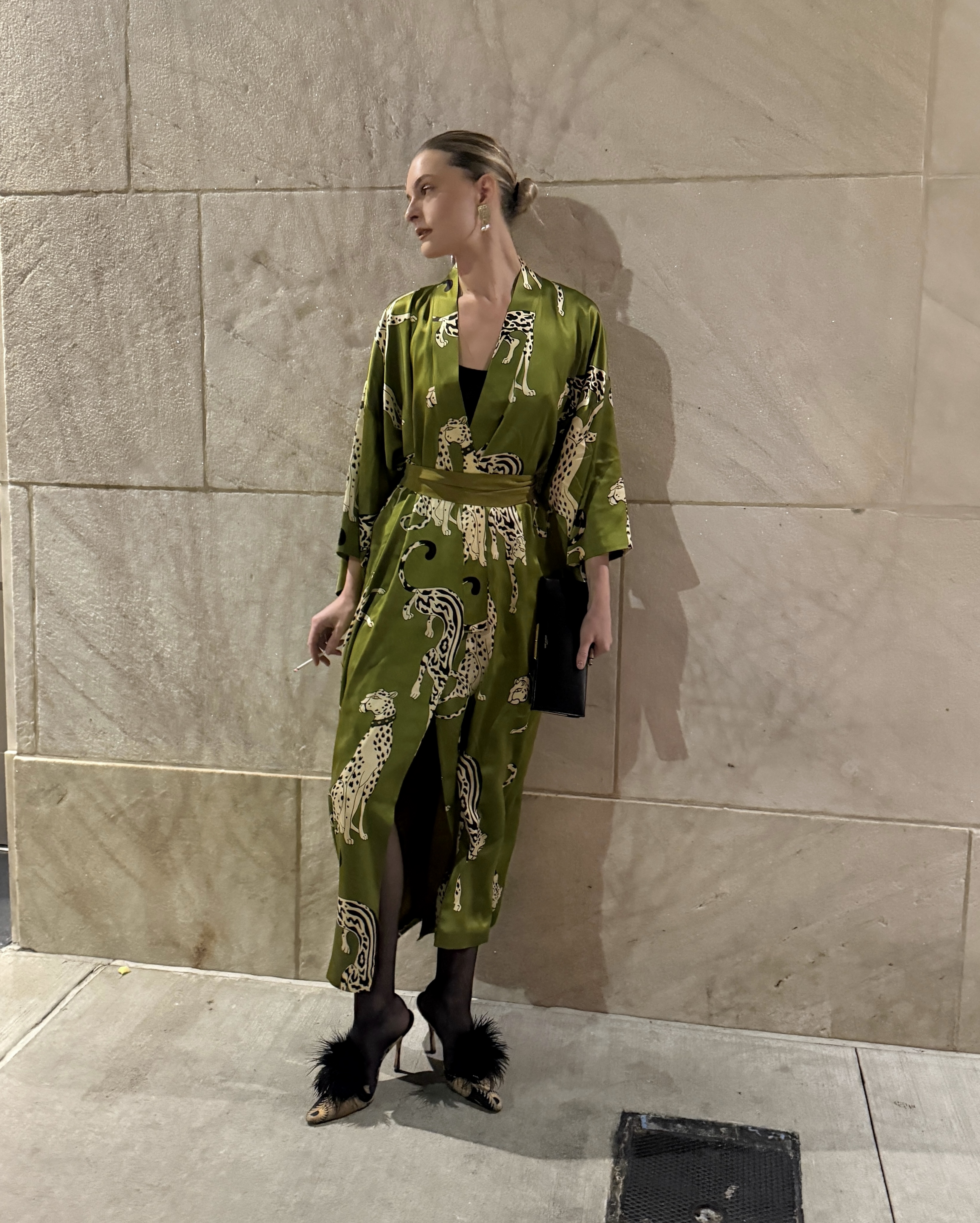 Christie Tyler wearing a silk robe coat.