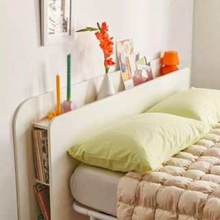 a closeup of the ruby headboard from urban outfitters with shelving
