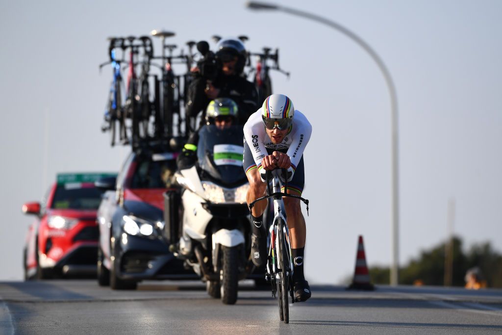 Filippo Ganna in front of an Ineos Grenadiers team car stacked with bikes during Tirreno-Adriatico