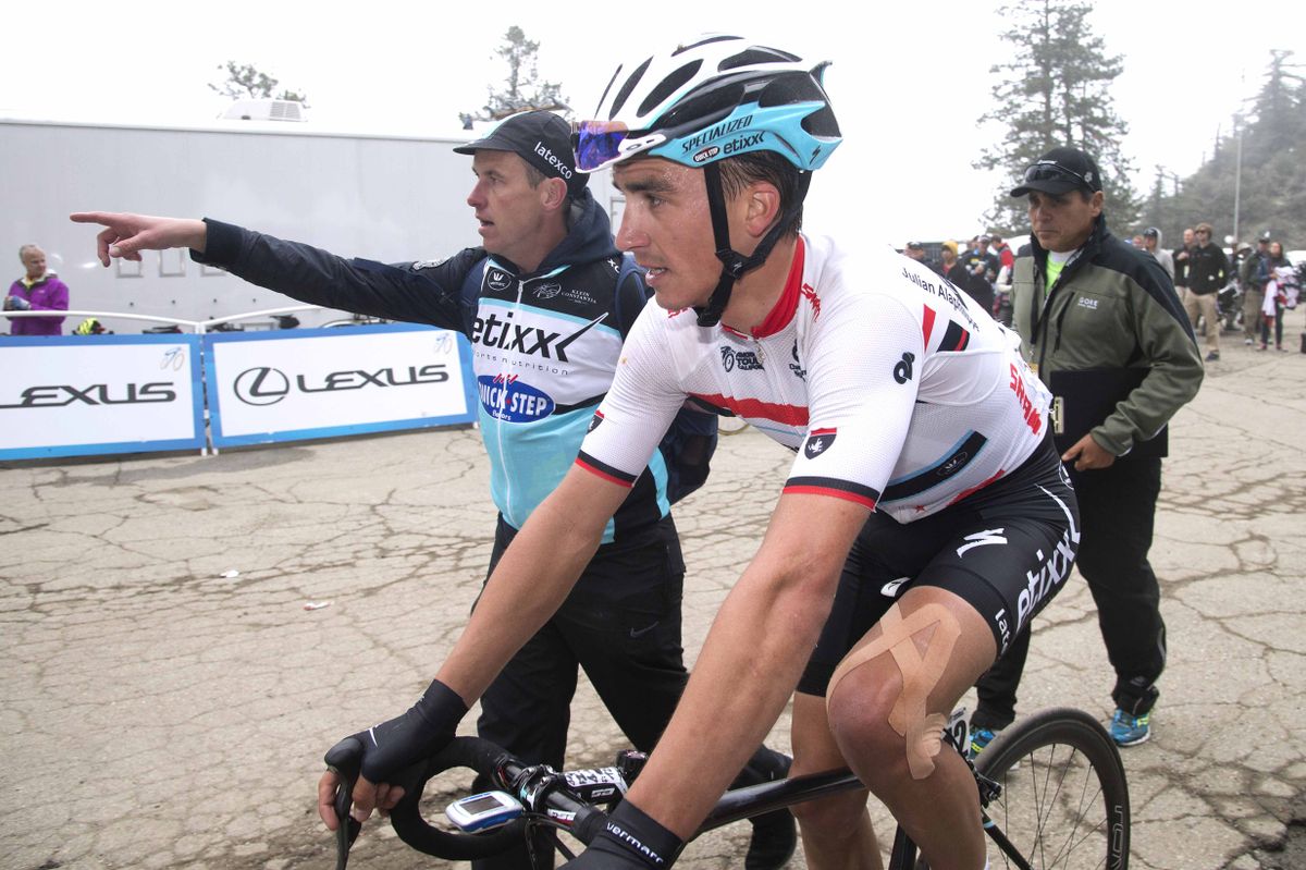 Julian Alaphilippe (Etixx-Quickstep) gets directions to the podium after his win