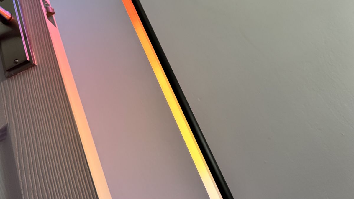 WiZ Gradient Floor Lamp illuminated in yellow and orange gradient
