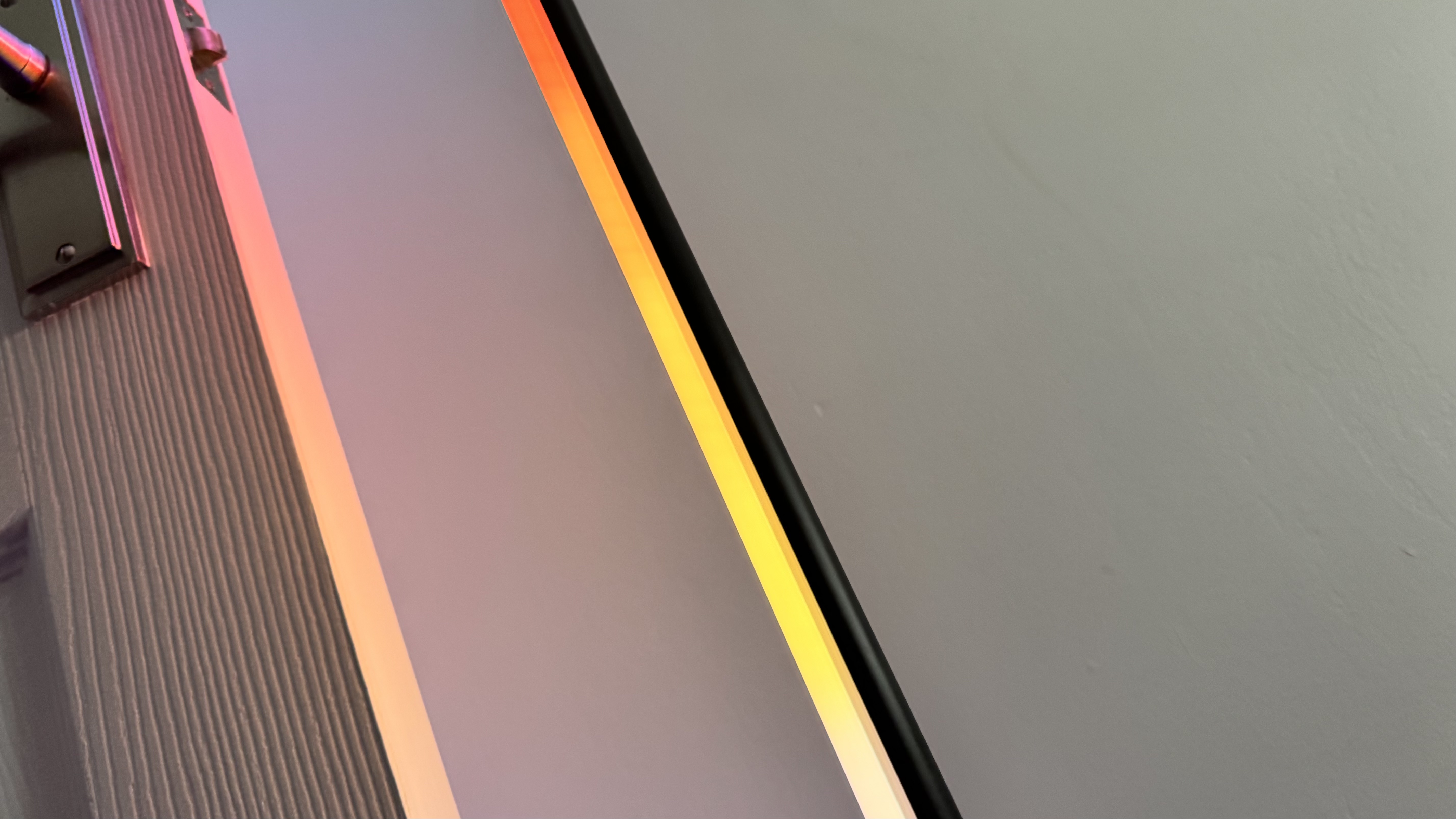 WiZ Gradient Floor Lamp illuminated in yellow and orange gradient