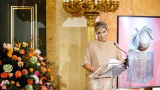 queen maxima in gold gown