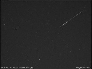 An Orionid meteor streaks across the night sky over Huntsville, Ala., in this view from a camera at NASA's Marshall Space Flight Center before dawn on Oct. 21, 2012