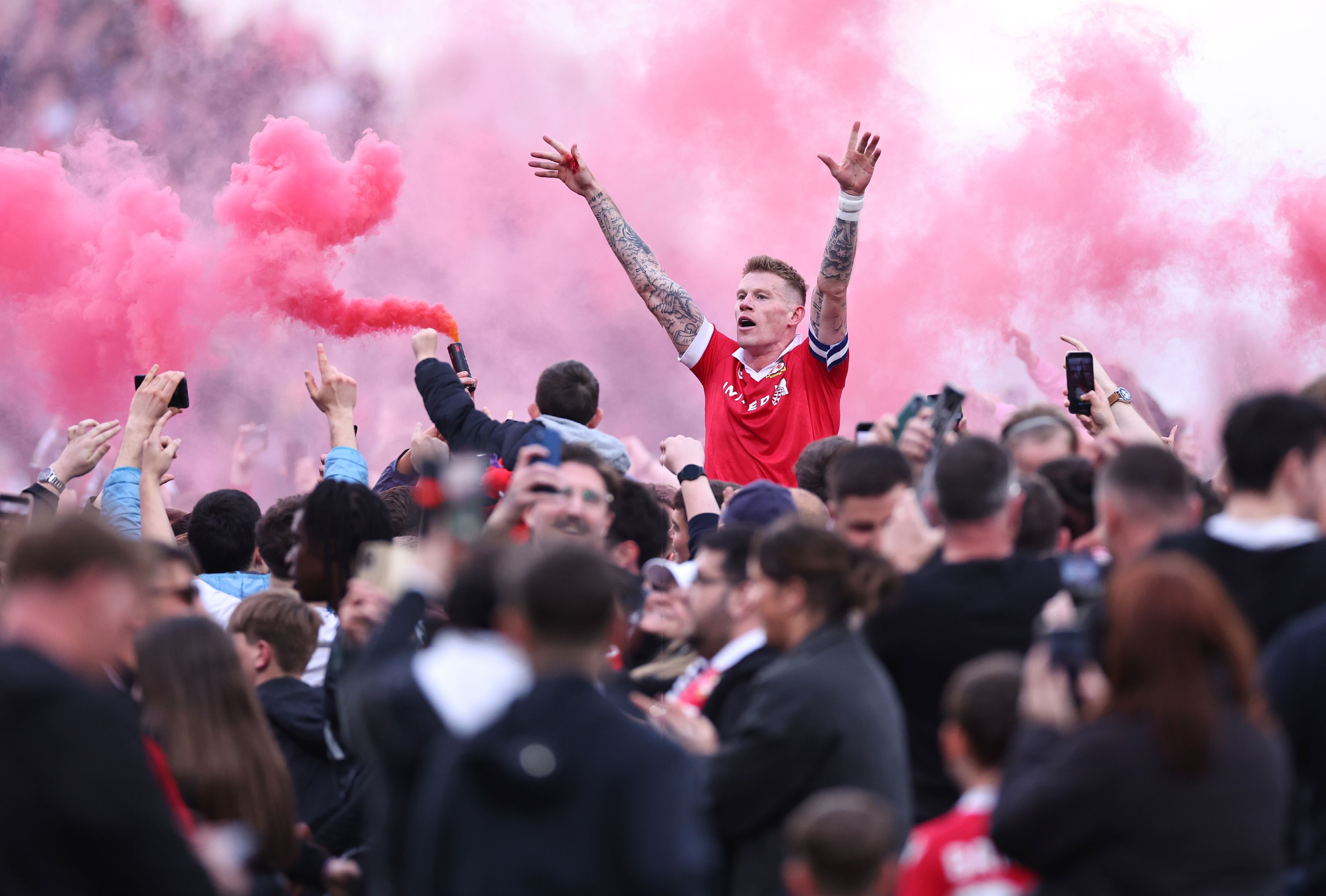 WREXHAM, WALES Wrexham fans invade the Racecourse Ground to party with skipper James McClean after reaching the Championship – the Red Dragons’ third consecutive promotion. A tale of grit, determination, community spirit and the, er, deep, deep pockets of Deadpool.