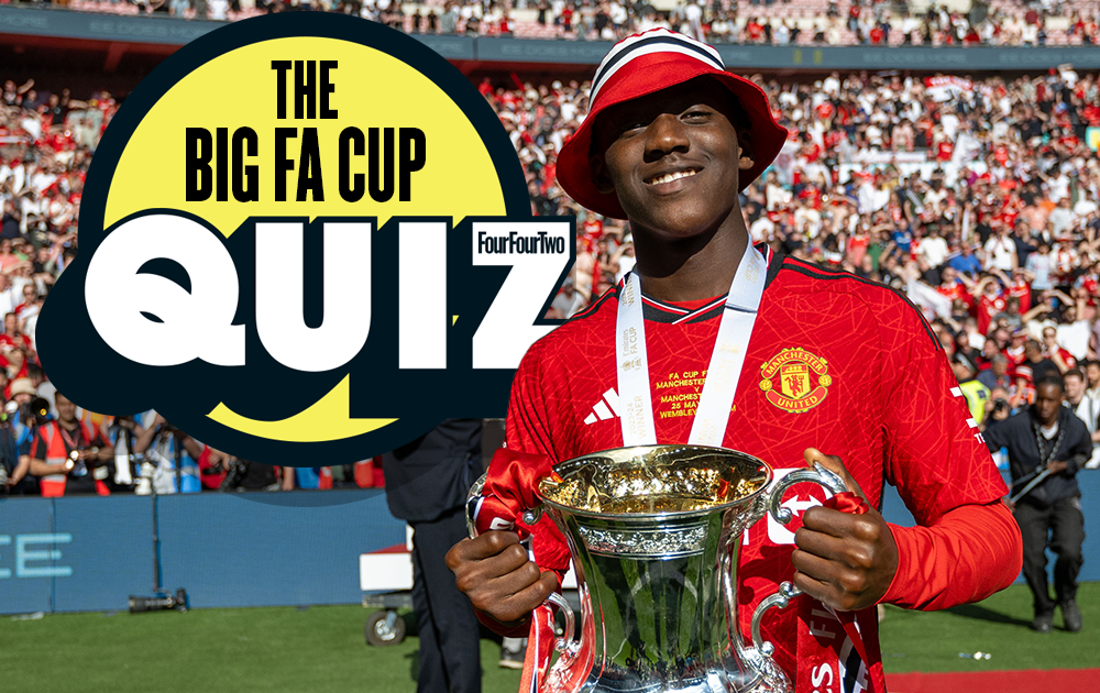 Kobbie Mainoo holds the FA Cup while wearing a bucket hat after the 2024 final, next to the &quot;Big FA Cup Quiz&quot; logo