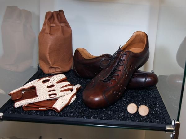 Dromarti shoes and gloves are also included in the gallery display.